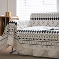 Bohemian cream sofa throw cover with black geometric patterns and ruffled edge detail - X Geometric Ruffle