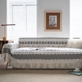 Bohemian geometric sofa cover in beige and orange with elegant ruffled hem edges - Linen Arrow Ruffle