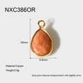 Vue détaillée du pendentif en pierre orange facettée avec cadre en cuivre plaqué or 18 carats - Style Rouge Orangé Goutte Facetté (NXC386OR)