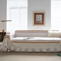 Bohemian sofa cover featuring colorful geometric patterns and decorative ruffle trim - Multicolor Mixed Geometric Ruffle