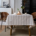Modern rectangle cotton linen tablecloth with black vertical stripes on a light wood table - 140*220cm / Black Fine Stripe