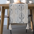 Boho cotton linen table runner with leaf pattern and cream tassels on wooden table - Curved Leaves Single-layered Flat Top Four White Tassels / Table Runner 33-140
