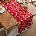 Red jacquard table runner with white flower and bird patterns featuring fringed tassels - Lucky Birds & Flowers
