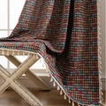Multicolor geometric woven blanket with tassels on a white bench under natural light - 150cmx160cm / Jacquard Color Knot (Rod Pocket)