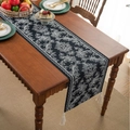 Elegant black table runner with white jacquard floral patterns and decorative white tassels - 35-120 / Black Phoenix White Tassel Style