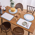 Modern beige cotton linen placemat set with blue scalloped embroidery on wood table - Blue Line
