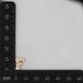 Detail view of gold letter F pendant with cubic zirconia inlay and 15mm size measurement - Gold F
