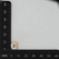 Macro view of gold letter G pendant with cubic zirconia inlay measuring 12mm x 13mm - Gold G