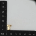 Macro shot of gold-plated letter Y pendant with dimensions 15mm by 12mm on a scale - Letter Y Pendant Only (Without Chain) / Gold