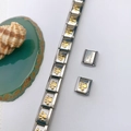 Détail du bracelet modulaire en acier inoxydable avec maillons or et argent à pattes - Style Empreinte de Patte (Style 113) / Pièce Unique