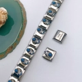 Detail of Italian charm bracelet showing blue stone inlay and stainless steel engraving - Blue Gemstone Floral Style (Style 108)