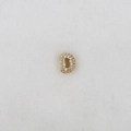 Macro shot of gold letter D pendant with sparkling zircon stones for DIY bracelets - Letter D Pendant