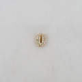 Macro shot of 18k gold plated letter U charm featuring micro-paved white zircon stones - Letter U Pendant