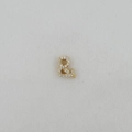 Detailed close-up of a gold ampersand pendant with micro-pave cubic zirconia stones - Symbol Pendant