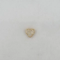 Detailed macro view of a heart-shaped jewelry charm with pavé cubic zirconia inlay - Heart Pendant