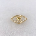 Macro detail of gold-plated evil eye charm with sparkling cubic zirconia on white fur - Gold Evil Eye (Style 132)