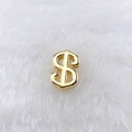 Detailed view of a gold dollar sign pendant with a polished metallic finish on plush - Dollar Sign Style (250 Styles) / Gold