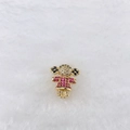 Detailed close-up of a girl-shaped charm with pink and white cubic zirconia on gold base - Golden Multicolored Girl Styles (222 Styles)