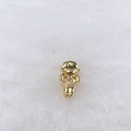 Close-up of golden girl charm with sparkling zircon crystals on soft white texture - Golden Pigtails Girl Style (226)