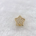 Detailed close-up of golden star charm accessory with white zircon pavé setting on plush fabric - Gold Five-pointed Star (Style 194)