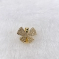 Detail of a gold butterfly charm with clear zircons on a white plush texture - Gold Multi-Color Butterfly (Style 144)