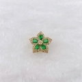 Macro detail of a gold flower charm featuring pear-shaped green stones and white pavé zircons - Golden Five-Petal Flower with Green Rhinestone (Style 238)