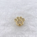Macro shot of gold-plated paw charm with cubic zirconia for DIY bracelets - Gold Rhinestone Paw Print (Style 150)