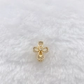 Close-up of golden clover pendant with micro-set zircons on white fur background - Gold Cross Flower (Style 206)