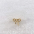 Detail of a gold plated bow charm accessory with pave set white cubic zirconia crystals - Gold Bow Pendant (Style 246)
