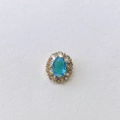 Detailed view of an oval blue birthstone pendant set in gold with zircon accents - Light Blue Stone Style (#9 Pendant Only)