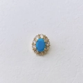 Detailed view of an oval blue birthstone pendant with sparkling zircon halo in gold plating - Turquoise Color Style (#12 Pendant Only)