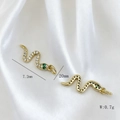 Macro detail of a 20mm golden snake pendant with white zircons and green gem eyes - Pendant Only (Without Chain) / Snake Style (#1)