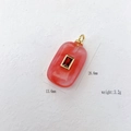 Pink gemstone pendant necklace with red zircon inlay in golden finish, 26.6mm x 13.6mm - Watermelon red