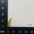 Macro shot of a 15mm golden leaf pendant weighing 0.5g on a black measuring scale - Leaf Vein Shape Style (#10)