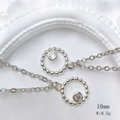 Detail showing a 10mm silver sun pendant necklace with sparkling round cubic zirconia - Beaded Ring Single Diamond Style (Style A) / Pendant Only (No Chain) / Silver