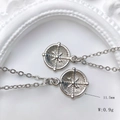 Macro shot of silver sun coin pendant with dimensions 11.5mm diameter and 0.9g weight - Cross Starburst Coin Style (Style E)
