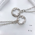 Macro shot of 11mm silver sunburst charms with zircon stones for DIY jewelry making - Irregular Texture Ring Style (Style M)