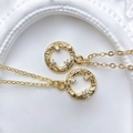 Close-up of golden sun-textured round pendants with inlaid sparkling zircon crystals - Hammered Texture Ring Style (Style N)