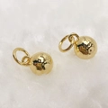Macro shot of polished gold spherical pendants with rings on white plush background - Necklace-Smooth Ball (Style M) / Gold