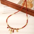 Red beaded necklace with gold fish pendant and white teardrop charm for lunar new year - Like a Fish in Water