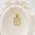 Elegant gold square shell pendant necklace with letter C on a vintage white frame - Letter C / White