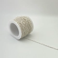 Detailed close-up of high-quality silver paperclip chain on a white plastic spool - Style C
