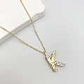 Fashionable gold-tone letter K pendant necklace featuring hammered metal and pave zircon - Letter K
