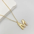 Fashionable gold letter M pendant necklace with hammered texture and cubic zirconia accents - M