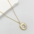 Golden necklace with irregular oval pendant featuring zircon inlay and hammered texture - Letter O