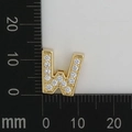 Detailed dimension shot showing golden W-shaped charm with white zirconias, size 10x12mm - Letter W