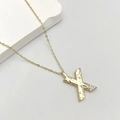 Golden necklace with letter X pendant featuring hammered texture and inlaid zircons - Letter X