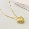 Elegant gold heart pendant necklace featuring unique textured lava finish on a box chain - Pendant With Chain / Heart