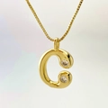 Golden necklace with letter C pendant featuring two sparkling inlaid stones - Gold C