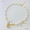 Fashion acrylic pearl necklace set with conch shells and golden bow pendant detail - Necklace Style B